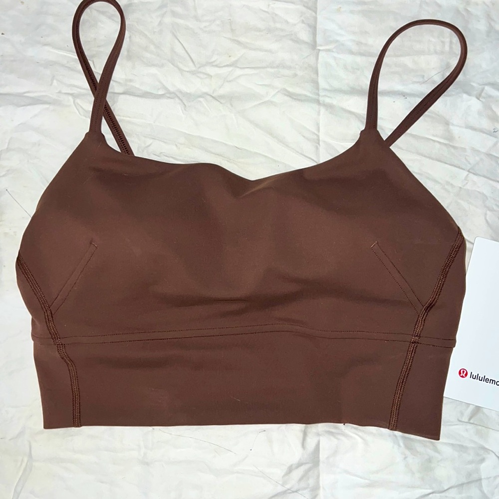 Lululemon Tank. Padded bra inside, with removable cups. Cropped/tight fit.
